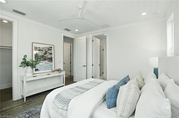 Bedroom featuring dark wood-style flooring, recessed lighting, ceiling fan, and wood ceiling