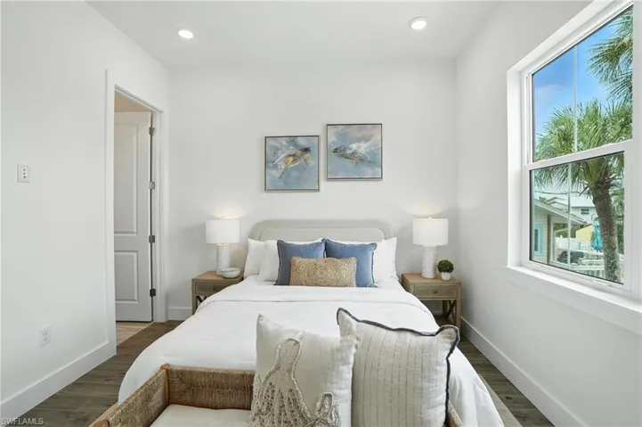 Bedroom featuring wood finished floors and recessed lighting-image virtually enhanced