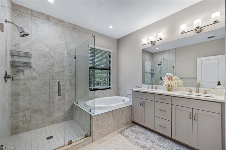 Master Bathroom - Featuring a Spacious Shower, Soaking Tub, and Dual Sinks