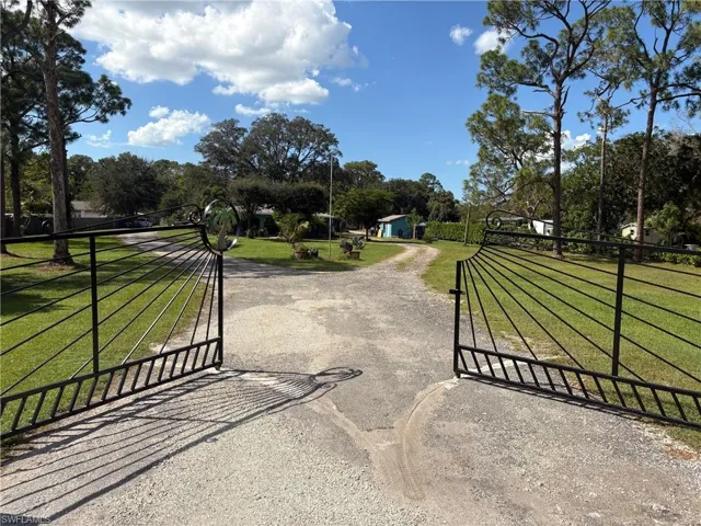 View of property's community featuring a lawn