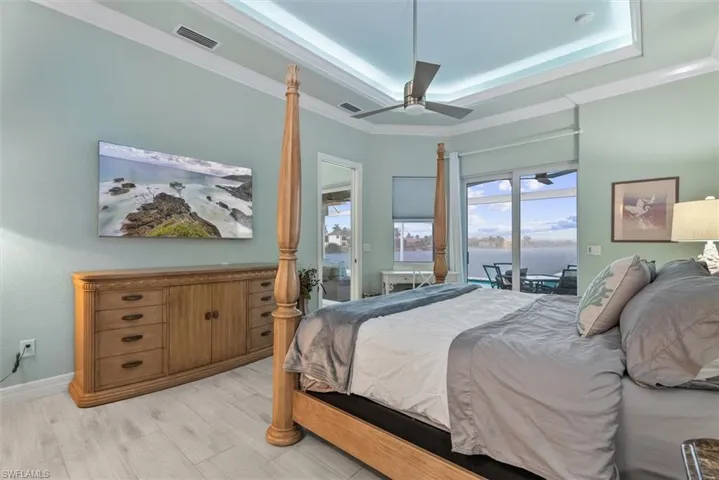 Tray ceiling with recessed lighting and crown molding