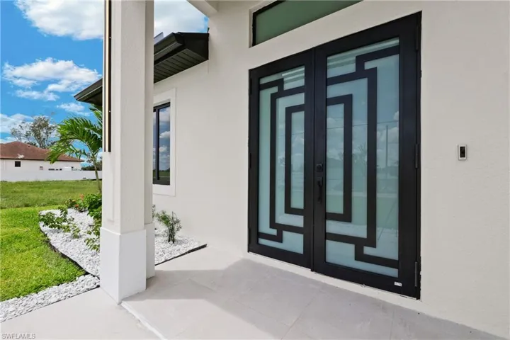 Entrance to property featuring french doors