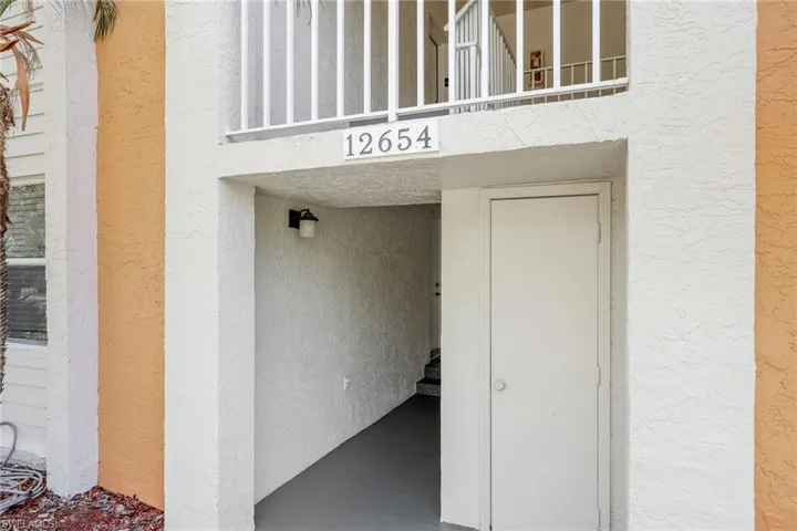Property entrance featuring a balcony