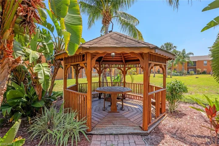 Wooden terrace with a yard and a gazebo