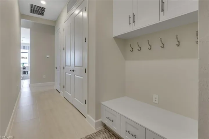Mudroom with light tile patterned floors