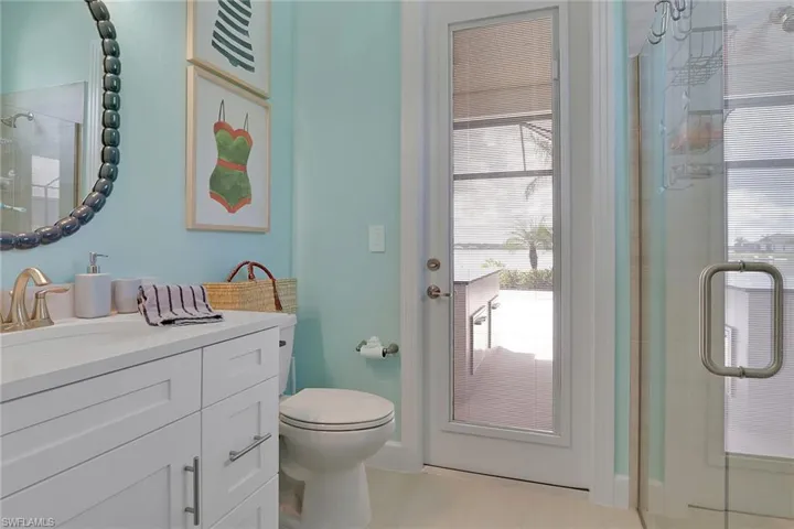 Full bathroom with a shower with shower door and vanity