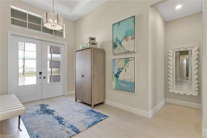 Foyer with french doors and a high ceiling