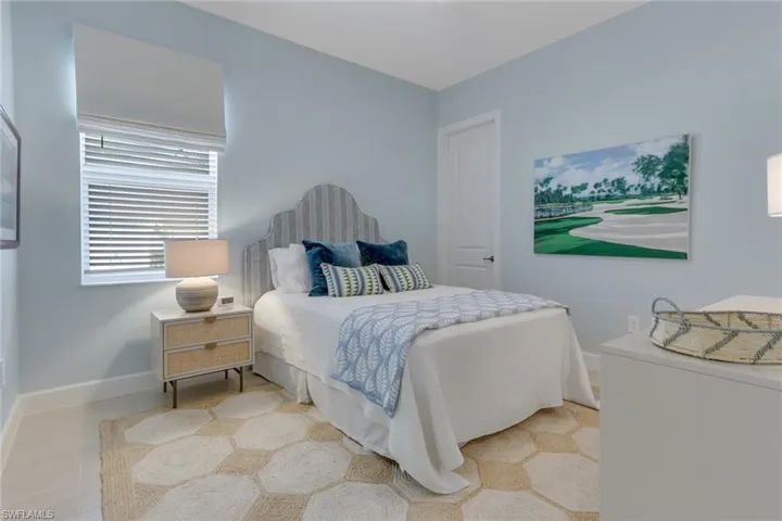 Tiled bedroom with baseboards