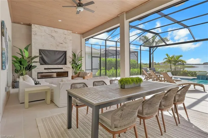 Sunroom featuring a patio area, ceiling fan, and outdoor dining area