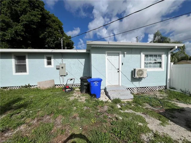 Side view of house with stucco siding