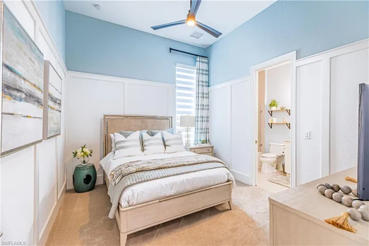 Bed 2 with custom wall details and ceiling fan