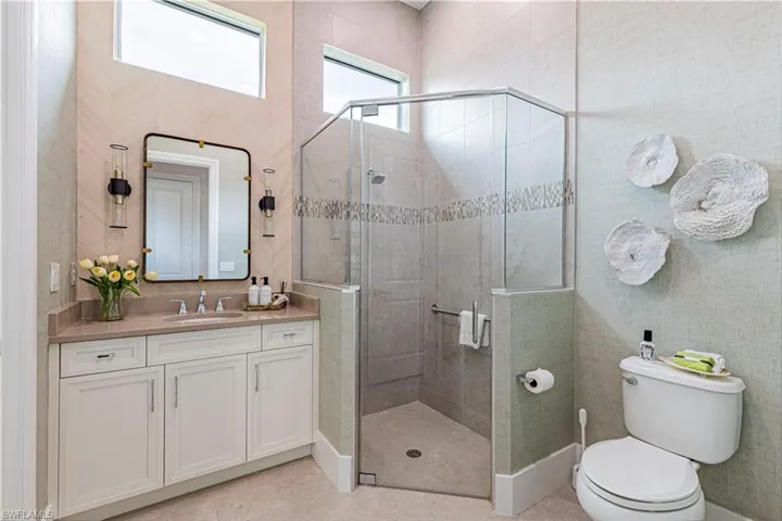 Bath 3 with wall sconces and wall coverings