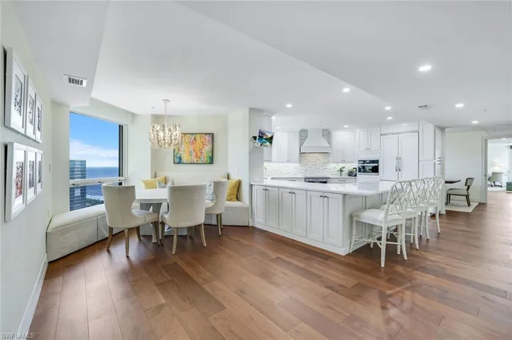 Adjacent to the kitchen, the breakfast area has a built in banquet and gorgeous beach views