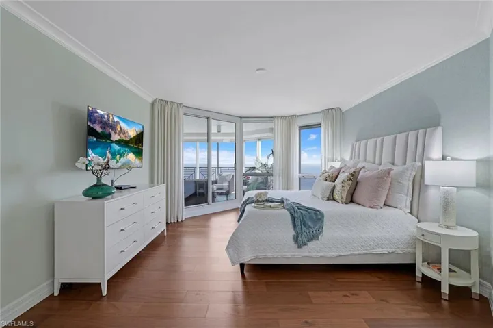 Primary Bedroom has beachfront lanai access and beautiful Gulf views
