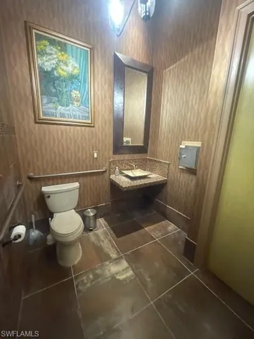 Bathroom featuring tile patterned flooring and toilet