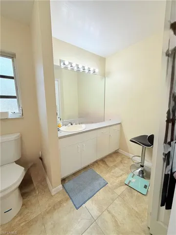 Bathroom with vanity and toilet