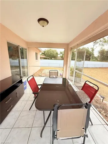 Sunroom with tile patterned flooring