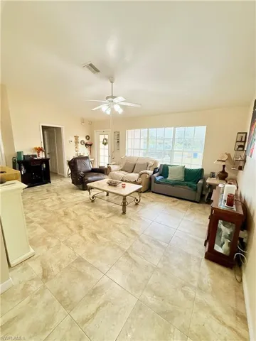 Living room featuring ceiling fan