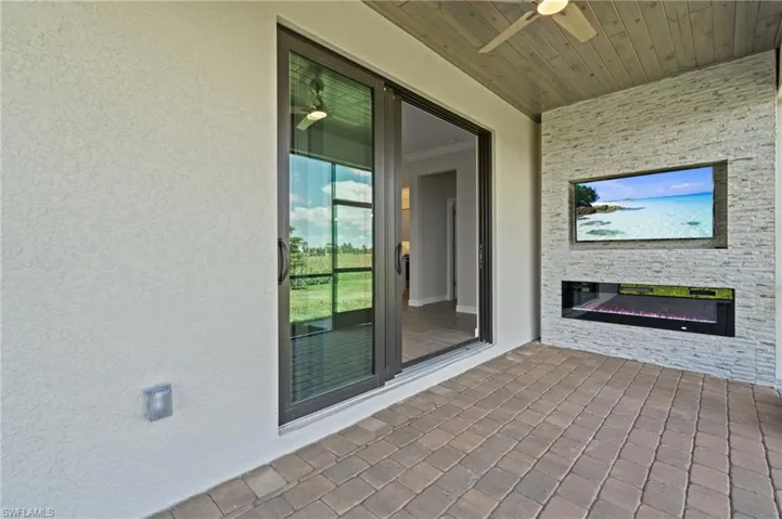 View of patio featuring ceiling fan