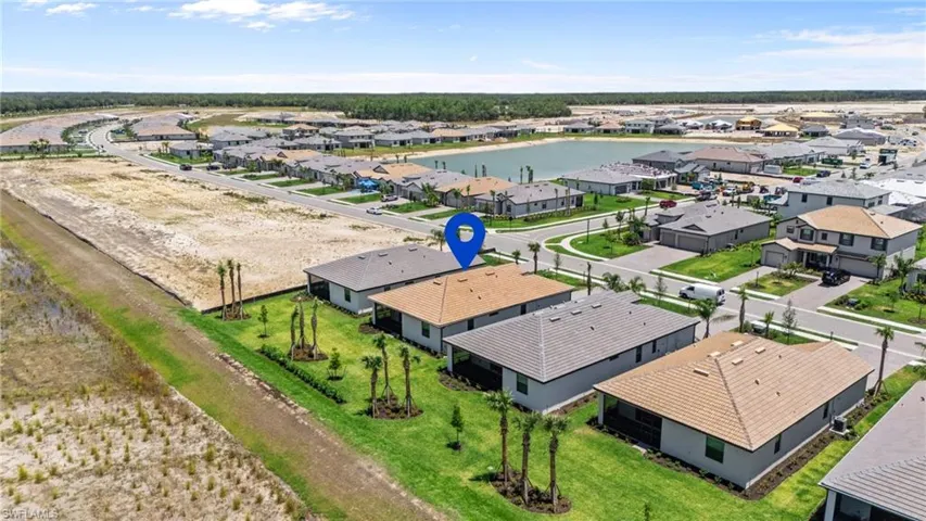 Aerial perspective of suburban area with a large body of water
