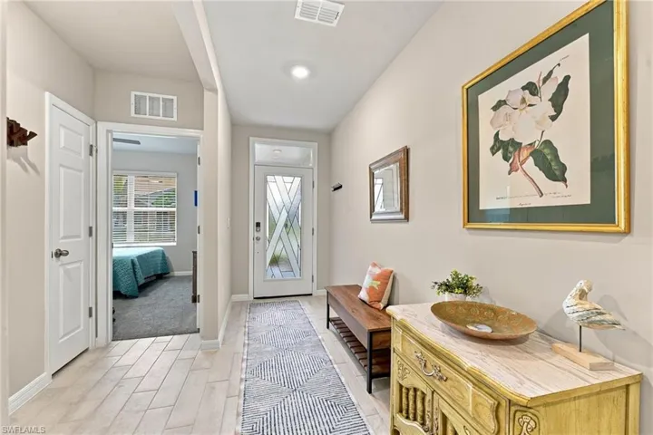 Upgraded Entry Door providing natural light.