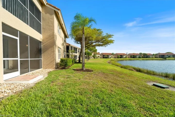 View of yard with a water view and a residential view