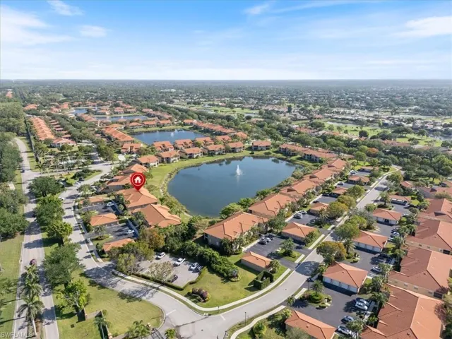 Birds eye view of property with a residential view and a water view