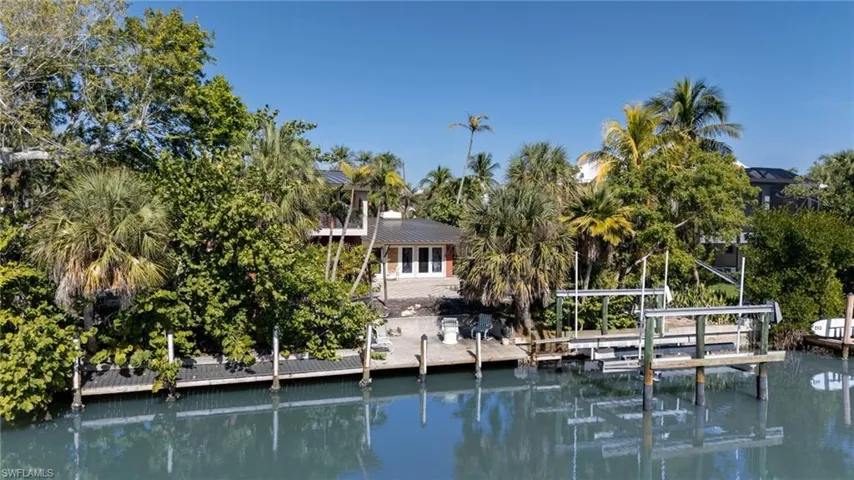 Dock featuring a water view and boat lift