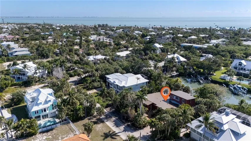 View of property location with nearby suburban area and a large body of water