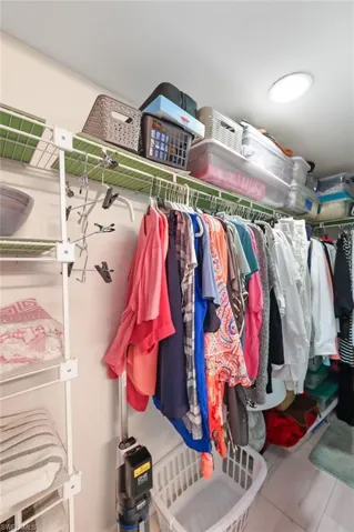 WALK-IN CLOSET IN PRIMARY BEDROOM
