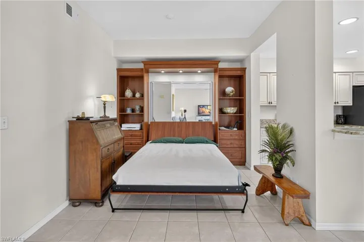 Integrated wall bed system with built-in shelving, drawers, and task lighting