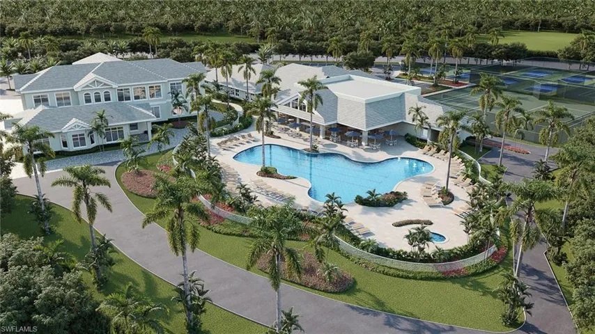 Expansive resort-style pool with surrounding lounge areas, accompanied by tennis courts and a large clubhouse structure