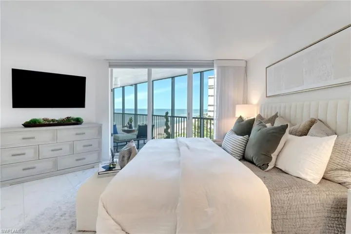 4651 Gulf Shore Blvd 806 - Primary Bedroom with Impact Sliders leading to the balcony area