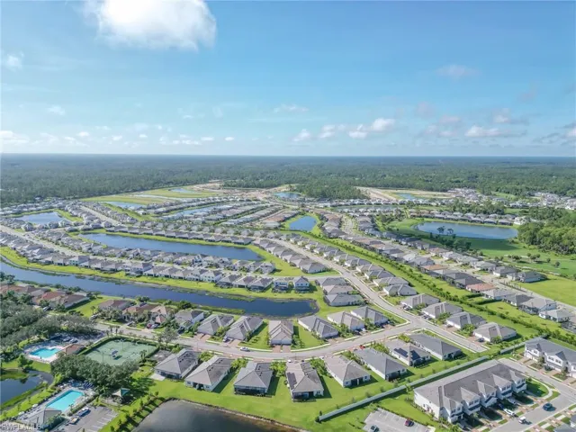 View of property location featuring nearby suburban area and a nearby body of water