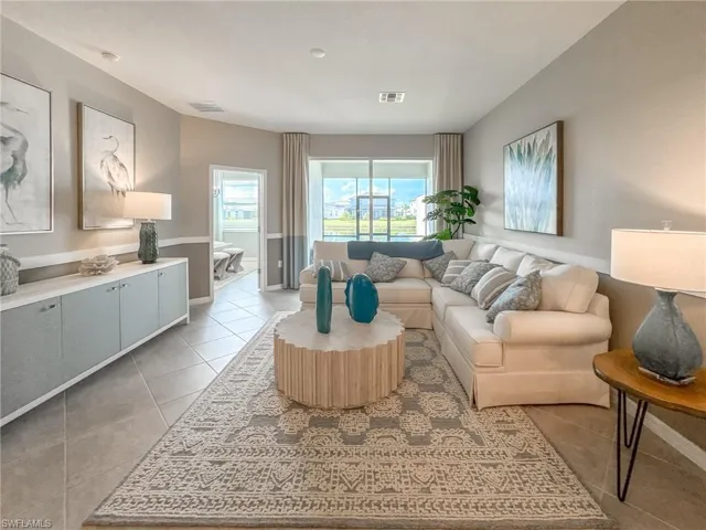 Living room featuring light tile patterned floors