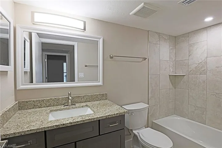 Full bathroom with vanity and  shower combination