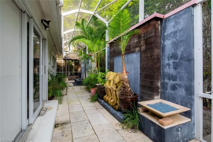 View of patio / terrace featuring glass enclosure