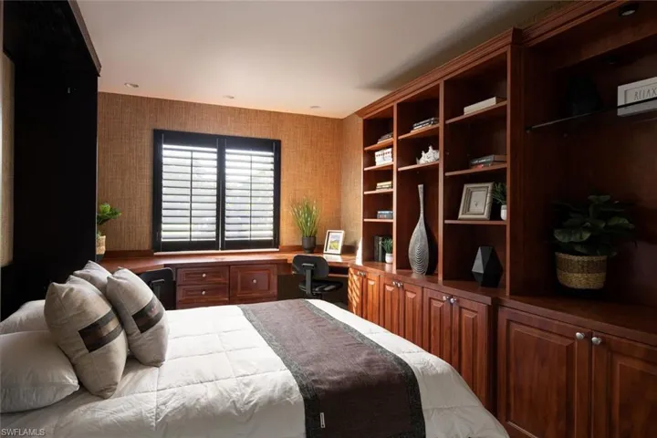 Bedroom with built in desk
