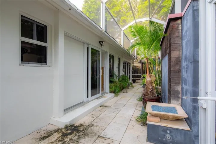 View of patio with glass enclosure