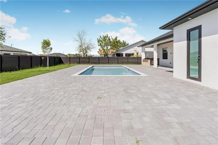 View of swimming pool with a fenced in pool, a fenced backyard, and a patio