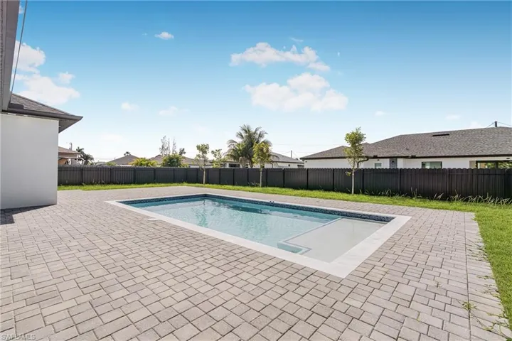 View of pool with a fenced in pool, a patio area, and a fenced backyard