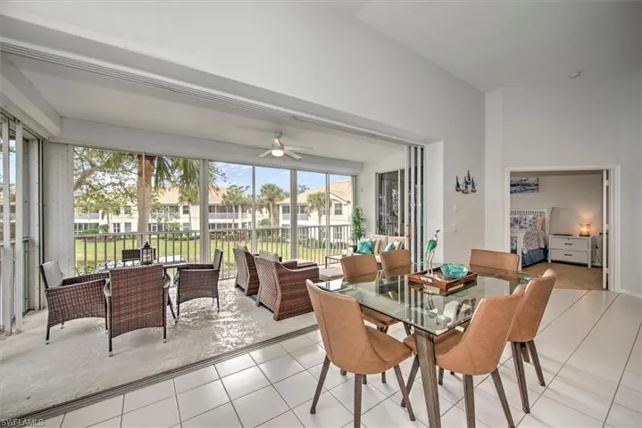 Dining area with ceiling fan and light tile patterned floors