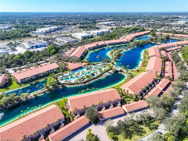 View of property location featuring a large body of water and apartment complex / building