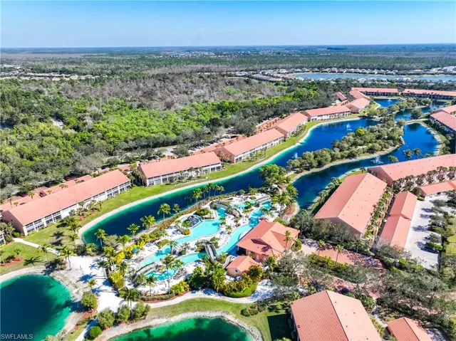 Aerial view of property's location with a large body of water
