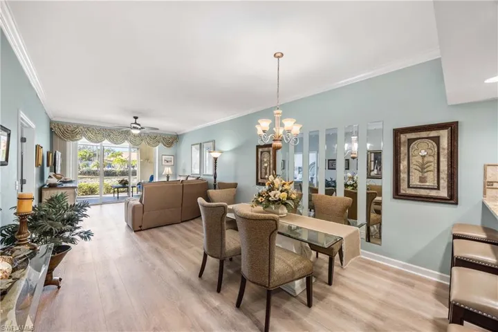 Dining room area, crown molding, new light wood  flooring