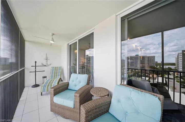 The lanai runs the length of the unit. Gulf breeze, open sky, and no upstairs neighbors — ever.
