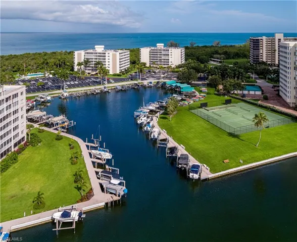 Water Turkey Bay sits just below — dolphins, kayakers, and boaters are part of the daily backdrop.