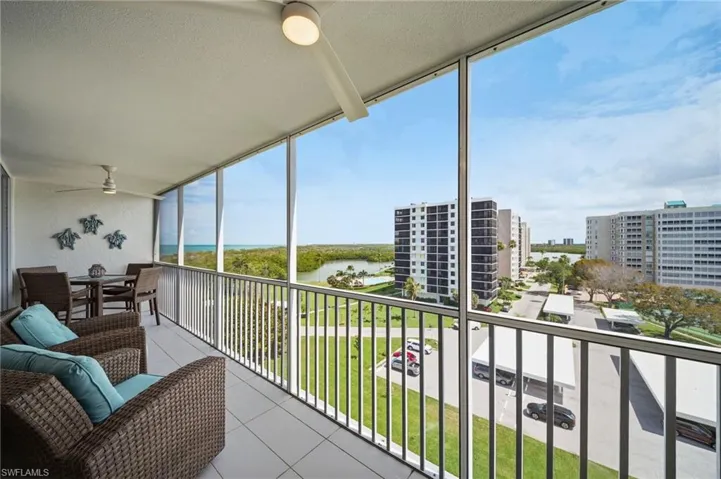 The balcony faces the bay — morning light, water views, and a quiet place to start the day.