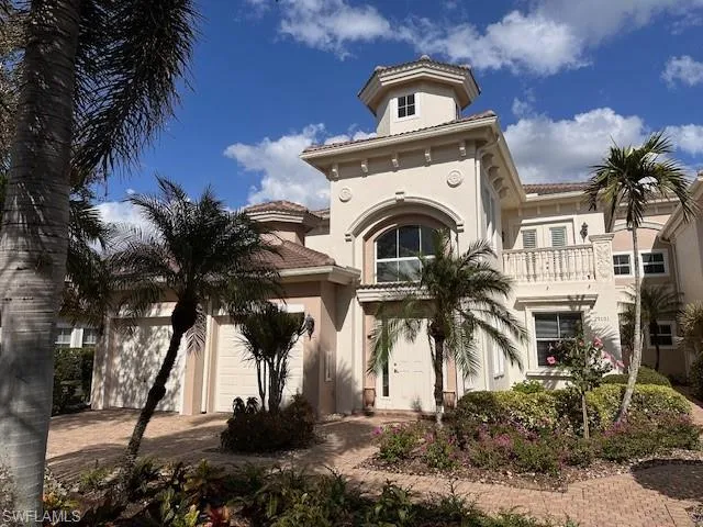 Mediterranean / spanish-style house featuring a garage