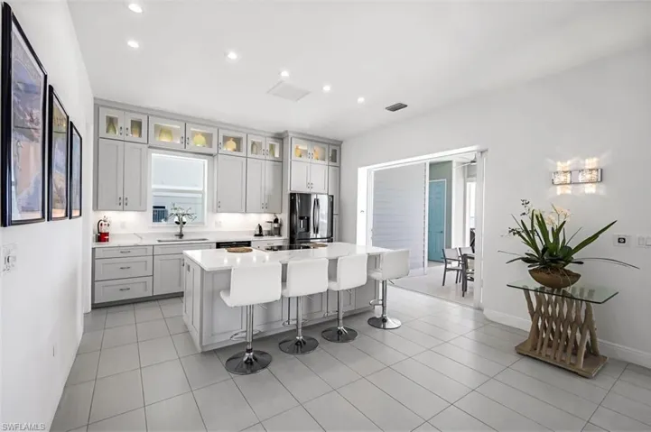 The Kitchen was remodeled in 2023 with sleek modern cabinets + quartz countertops